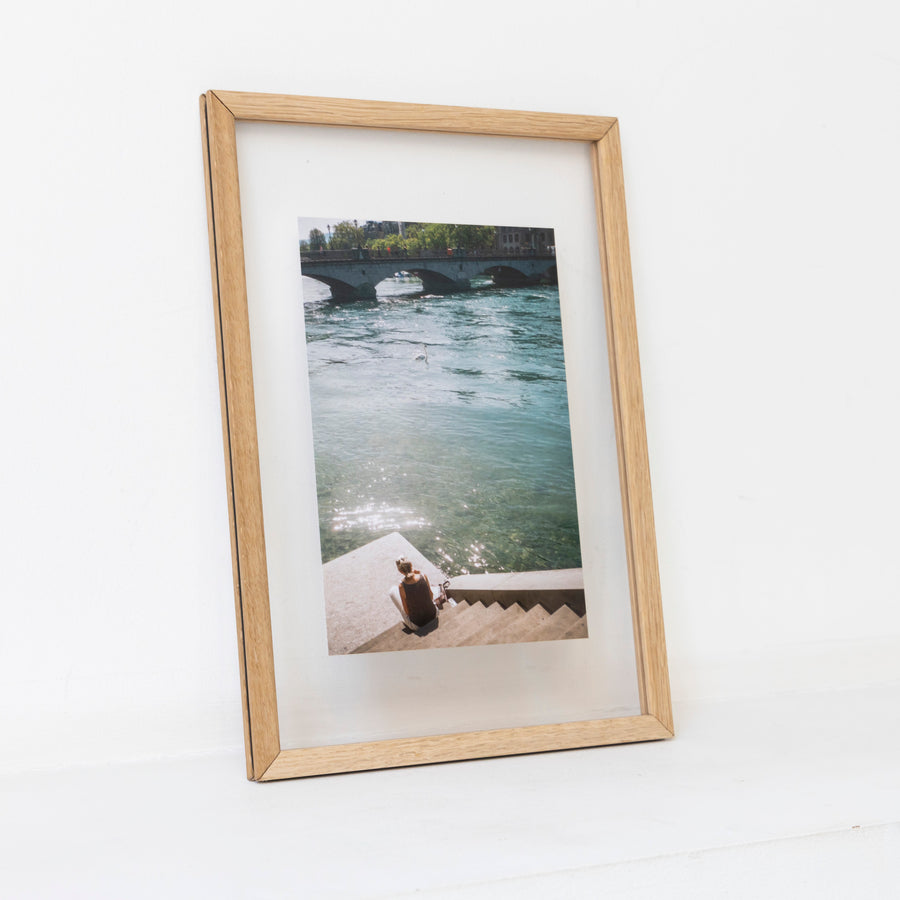 Girl resting with swan in Zurich / A4 oak frame